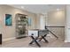 Cozy game room with foosball table, stylish shelving, and neutral colors offer a relaxed entertainment space at 5397 Marshelder St, Apopka, FL 32712