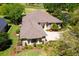 Aerial view of a home showcasing its well-maintained roof, landscaping, and proximity to a golf course at 6106 Spinnaker Loop, Lady Lake, FL 32159