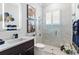 Modern bathroom with a glass-enclosed shower, floating vanity, and stylish decor at 6106 Spinnaker Loop, Lady Lake, FL 32159