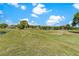 Picturesque view of a sprawling golf course with lush fairways and a tranquil pond at 6106 Spinnaker Loop, Lady Lake, FL 32159