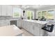 Beautiful kitchen features a large island, white quartz countertops, stainless steel appliances, and modern finishes at 6106 Spinnaker Loop, Lady Lake, FL 32159