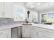 This well-equipped kitchen features stainless steel appliances, a modern backsplash, and a bright, airy atmosphere at 6106 Spinnaker Loop, Lady Lake, FL 32159