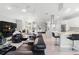 Spacious open-concept living area with multiple seating options and view to kitchen and dining area at 6106 Spinnaker Loop, Lady Lake, FL 32159