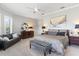 Spacious main bedroom features a ceiling fan, dresser, and plantation shutters at 6106 Spinnaker Loop, Lady Lake, FL 32159