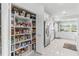 Spacious walk-in pantry with abundant shelving and food storage at 6106 Spinnaker Loop, Lady Lake, FL 32159