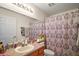 Bathroom featuring vanity, mirror, and patterned shower curtain at 638 Sierra Cir, Davenport, FL 33837