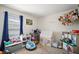 A fun bedroom with a play tent, toys, carpet floors, and a window at 638 Sierra Cir, Davenport, FL 33837