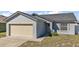 Charming single-Gathering home with a one-car garage and well-maintained front lawn at 638 Sierra Cir, Davenport, FL 33837