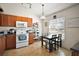 Well-lit kitchen with a microwave and dining table adjacent to it at 638 Sierra Cir, Davenport, FL 33837