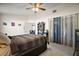 Spacious main bedroom with ceiling fan, large window, neutral walls, and plush carpeting for added comfort at 638 Sierra Cir, Davenport, FL 33837