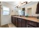 Bathroom with a dual sink vanity with lots of counter space and a glass door shower at 6679 Cr 613, Bushnell, FL 33513