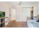 This bright bedroom offers easy access to a hallway and has a clean, uncluttered aesthetic at 6679 Cr 613, Bushnell, FL 33513