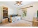 This simple bedroom offers a comfortable daybed and a bright window view of the backyard at 6679 Cr 613, Bushnell, FL 33513