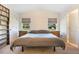 This comfortable main bedroom has a vaulted ceiling and dual windows that flood the space with natural light at 6679 Cr 613, Bushnell, FL 33513