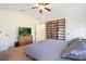 This cozy main bedroom has a vaulted ceiling and a large bookcase for storing movies and books at 6679 Cr 613, Bushnell, FL 33513