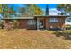 Charming single-story brick home with a cozy front porch and well-maintained landscaping at 6988 Blue Cedar Rd, Leesburg, FL 34748