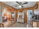 Charming kitchen features wood walls, tile floors, and an antique hutch at 6988 Blue Cedar Rd, Leesburg, FL 34748