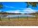 A scenic view of the private lake that features a peaceful and serene landscape at 6988 Blue Cedar Rd, Leesburg, FL 34748
