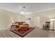 Open concept living room features wood floors, neutral walls, and ceiling fan at 733 Palma Dr, The Villages, FL 32159