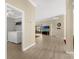 View of the living room and laundry room with a washer and dryer, light walls, and wood floors at 733 Palma Dr, The Villages, FL 32159
