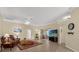 Bright living room with wood floors, neutral walls, and sliding glass doors to patio at 733 Palma Dr, The Villages, FL 32159