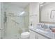 Modern bathroom featuring a frameless glass shower and granite vanity top, offering both style and functionality at 737 Caldwell Ct, The Villages, FL 32162