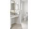 Bright bathroom with a vanity, granite countertop, and tile flooring, creating a clean and functional space at 737 Caldwell Ct, The Villages, FL 32162