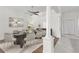 Dining room featuring a glass table, modern decor, and beautiful floors at 737 Caldwell Ct, The Villages, FL 32162