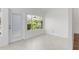 Bright Florida Room featuring tile floors, a glass door, and lots of natural light at 737 Caldwell Ct, The Villages, FL 32162