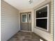 Inviting front door with decorative glass and tiled entryway, creating a warm and welcoming entrance to the home at 737 Caldwell Ct, The Villages, FL 32162