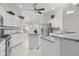 Bright kitchen featuring stainless appliances, granite countertops, and center island at 737 Caldwell Ct, The Villages, FL 32162