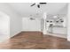Large living room featuring hardwood floors, archways, and an open floor plan at 737 Caldwell Ct, The Villages, FL 32162