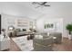 Bright living room featuring hardwood floors, neutral walls, modern decor, and plenty of natural light at 737 Caldwell Ct, The Villages, FL 32162