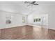 Bright living room featuring hardwood floors, neutral walls, and plenty of natural light at 737 Caldwell Ct, The Villages, FL 32162