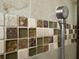 Close-up of the decorative shower with intricate mosaic tile work, adding a touch of artistry to the bathroom at 737 Caldwell Ct, The Villages, FL 32162