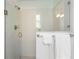 Glass enclosed shower stall featuring brushed silver shower head at 737 Caldwell Ct, The Villages, FL 32162