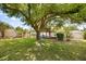 Spacious backyard featuring a large tree house and a swing for outdoor fun at 7636 Lake Angelina Dr, Mount Dora, FL 32757