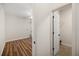 A bedroom leads to a walk in closet with access to the fire extinguisher at 7636 Lake Angelina Dr, Mount Dora, FL 32757