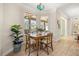 Charming dining area with natural light and a view of the outdoor patio at 7636 Lake Angelina Dr, Mount Dora, FL 32757