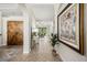 Inviting foyer showcasing arched doorways, tile flooring, and a glimpse into the spacious living area at 7636 Lake Angelina Dr, Mount Dora, FL 32757
