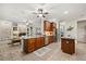 Spacious kitchen with a large island, modern appliances, and an open layout at 7636 Lake Angelina Dr, Mount Dora, FL 32757