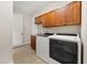 Spacious laundry room features a utility sink, and front load washer and dryer at 7636 Lake Angelina Dr, Mount Dora, FL 32757