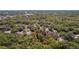 Aerial view of the lot surrounded by lush greenery, marked with a red border, in a serene, wooded neighborhood at 801 Kilgore St, Wildwood, FL 34785