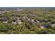 Aerial view showcases a lot within a verdant, peaceful, and tree-filled neighborhood, perfect for nature enthusiasts at 801 Kilgore St, Wildwood, FL 34785