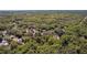 Aerial view of a tree-lined lot surrounded by lush greenery, offering a secluded and tranquil setting at 801 Kilgore St, Wildwood, FL 34785
