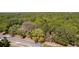 Aerial of the property boundary highlighting location near a local street and lush trees at 801 Kilgore St, Wildwood, FL 34785