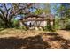 Exterior angle highlighting the vintage stone detail and architectural potential at 801 Kilgore St, Wildwood, FL 34785