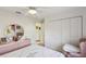 Serene bedroom featuring a dresser, closet, and natural light at 9857 Sw 63Rd Ct, Ocala, FL 34476