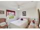 Comfortable bedroom with soft lighting, charming decor, and a relaxing ambiance at 9857 Sw 63Rd Ct, Ocala, FL 34476