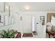 The foyer features decorative mirrors, a white door, and tile flooring that flow into the living spaces at 9857 Sw 63Rd Ct, Ocala, FL 34476